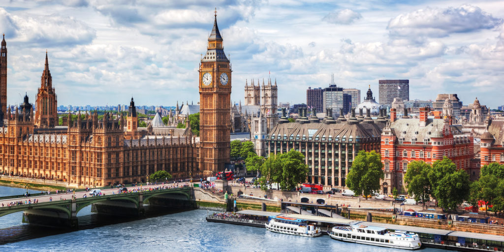 Big Ben, Westminster Bridge on River Thames in London, the UK. English symbol. Lovely puffy clouds, sunny day