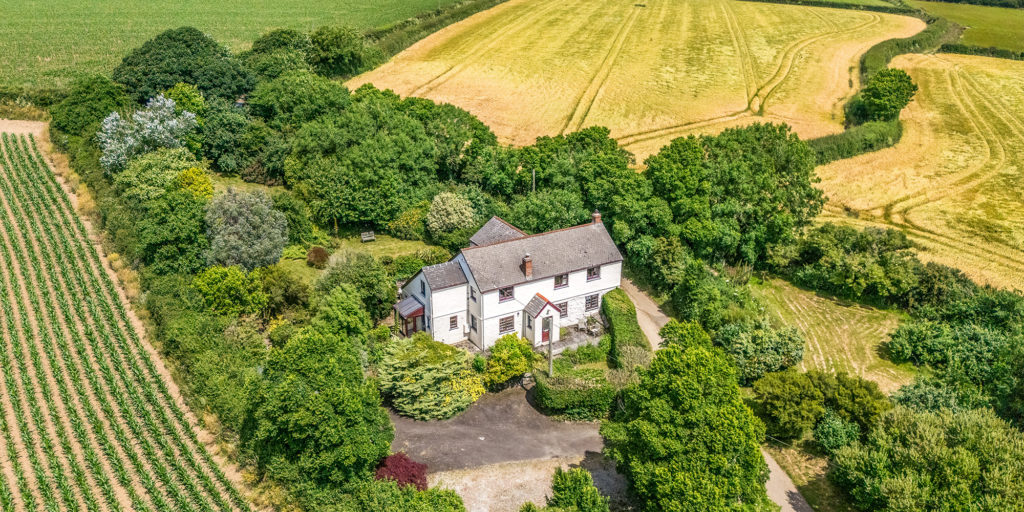 Lizard Peninsula property for sale with countryside views near the Helford River. Country house for sale Cornwall set within landscaped gardens on the Lizard Peninsula. Four bedroom house for sale near Helford Cornwall with rural views and private grounds. Luxury property Lizard Peninsula Cornwall offering south facing gardens and terrace. Family home for sale Cornwall with open plan kitchen, conservatory and countryside outlook. Character home for sale near Helford River with inglenook fireplace and wood burner. Detached house for sale Lizard Peninsula Cornwall with orchard and landscaped gardens. Cornwall countryside property for sale near the Helford with parking and outbuildings. Lizard Peninsula home for sale with panoramic rural views and modern interiors. Jackson Stops Cornwall property for sale near Helford River and the Lizard coast. Country home Cornwall with four bedrooms, conservatory and sun terrace. Detached family house for sale Cornwall with generous driveway and mature gardens. Property for sale near Helford Cornwall combining character features and contemporary living. Lizard Peninsula residential property for sale in peaceful countryside setting. Cornwall estate agents Jackson Stops marketing homes on the Lizard Peninsula.